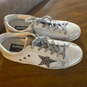 Golden Goose Superstar leather low sneakers with silver mesh and leopard star.